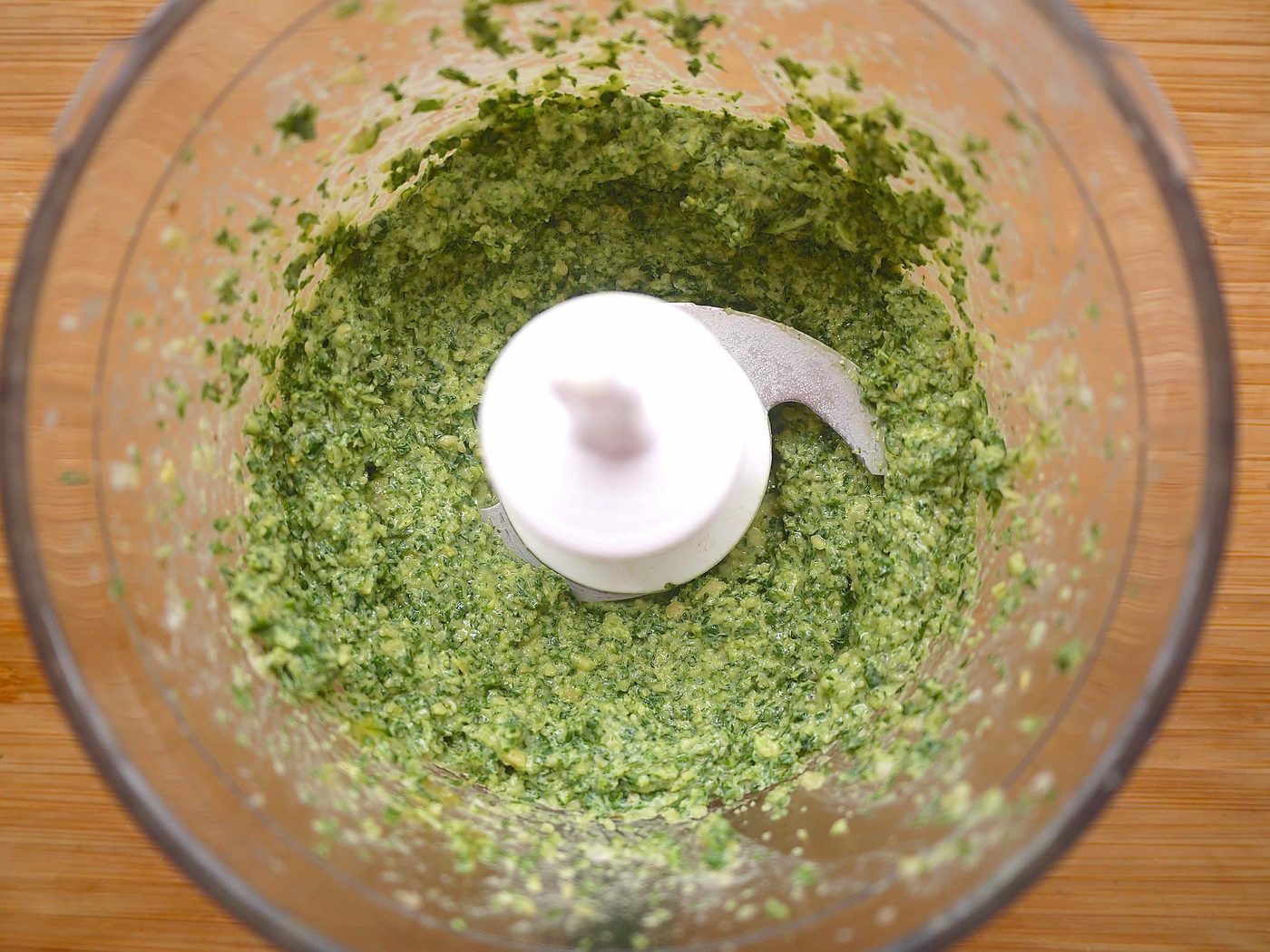 Kale and basil added to garlic.