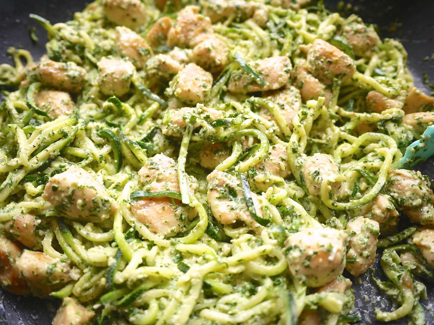 Zoodles in a pan with chicken.