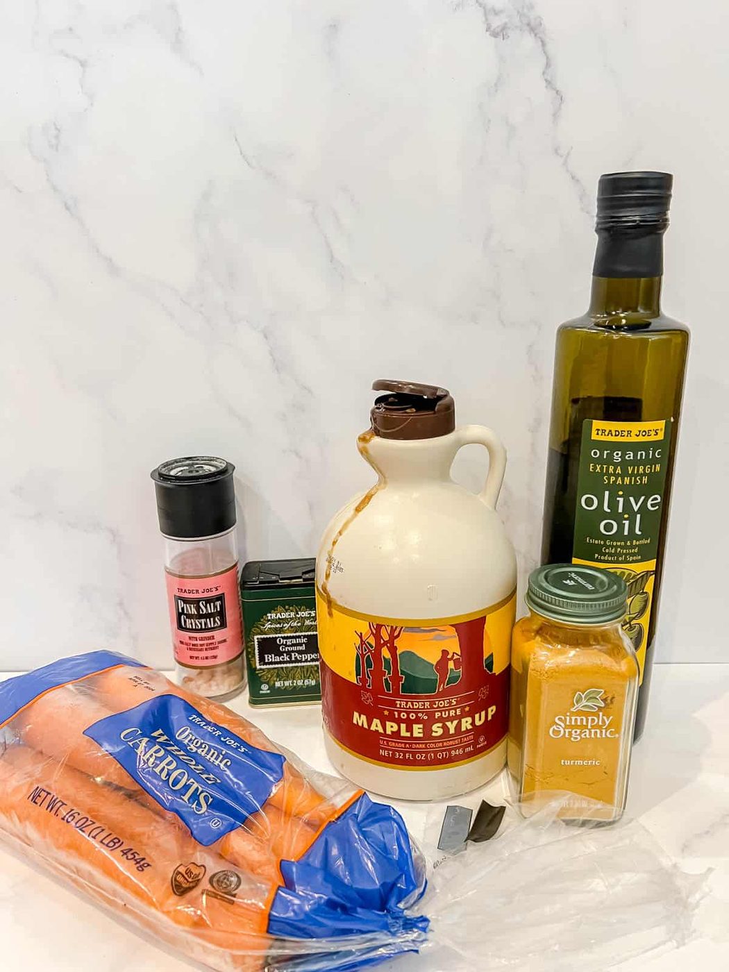 Ingredients needed to make turmeric maple glazed carrots.