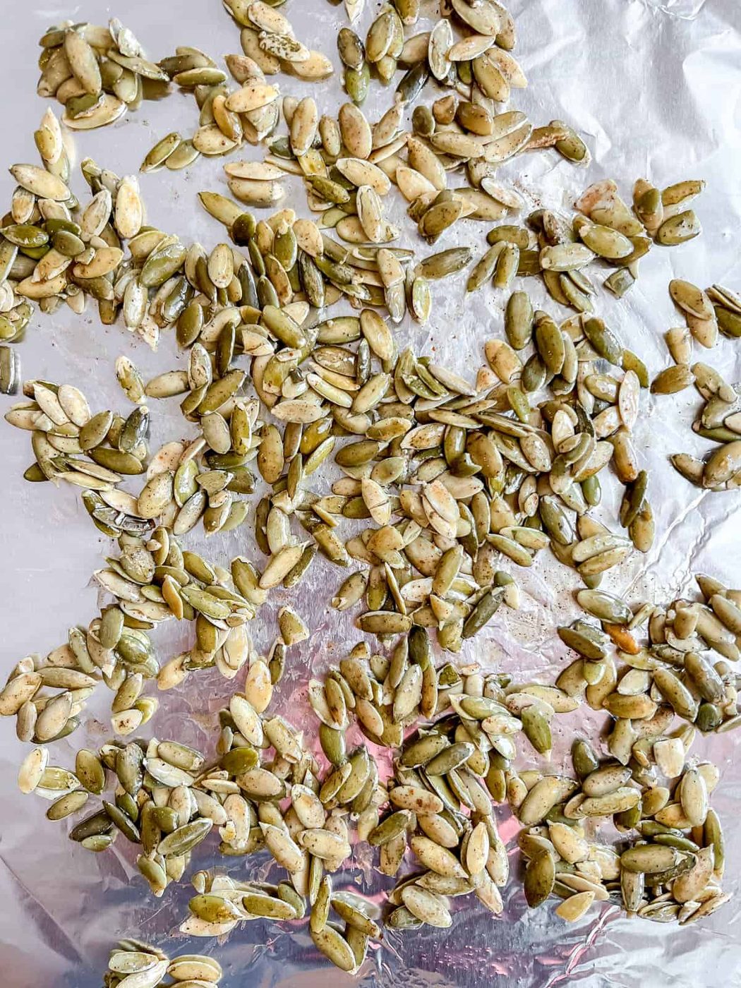 Pepitas on a cookie sheet before baking.