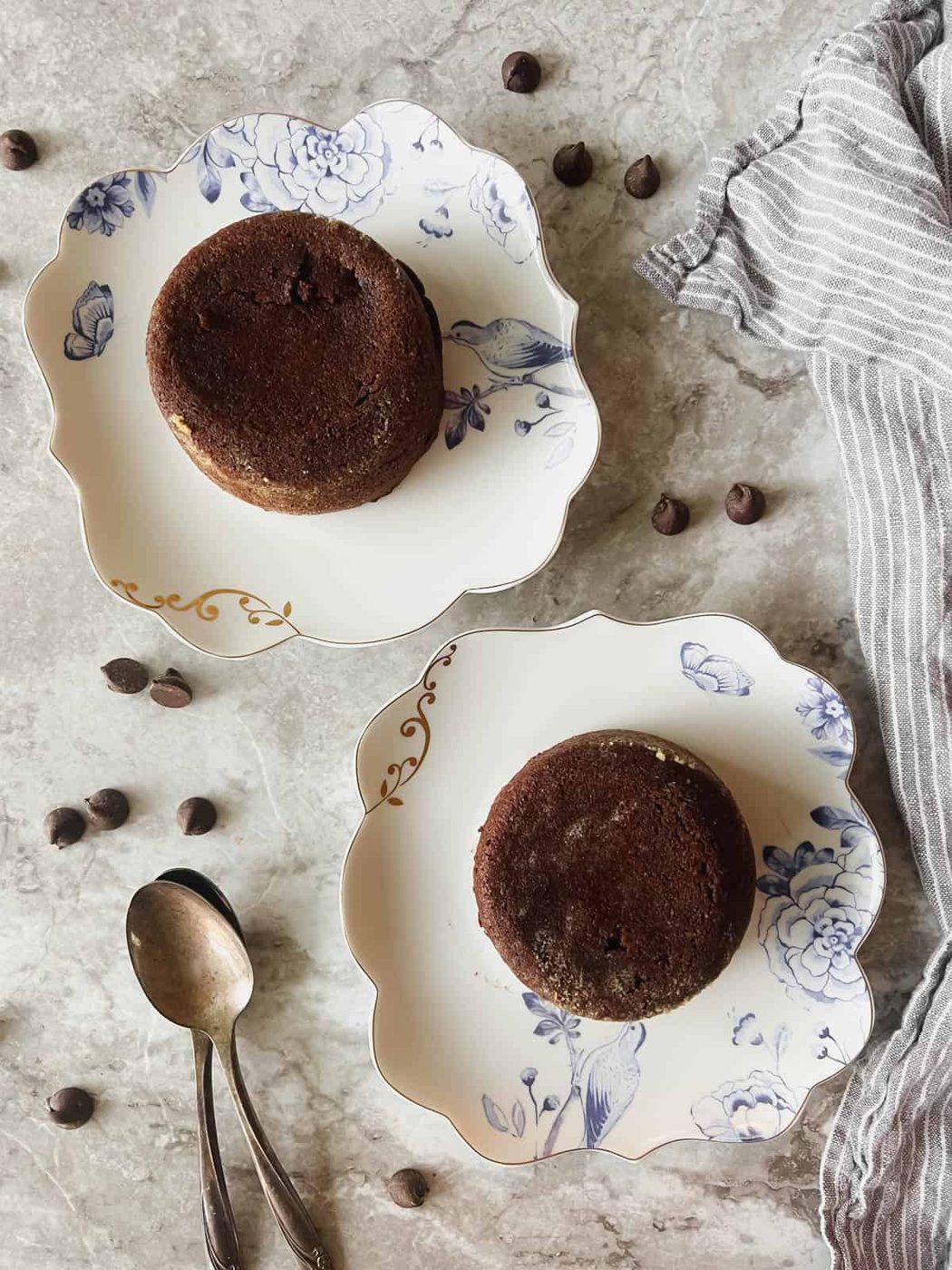 Lava cakes upside down on plates.