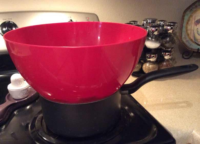 Melting chocolate over the stove.