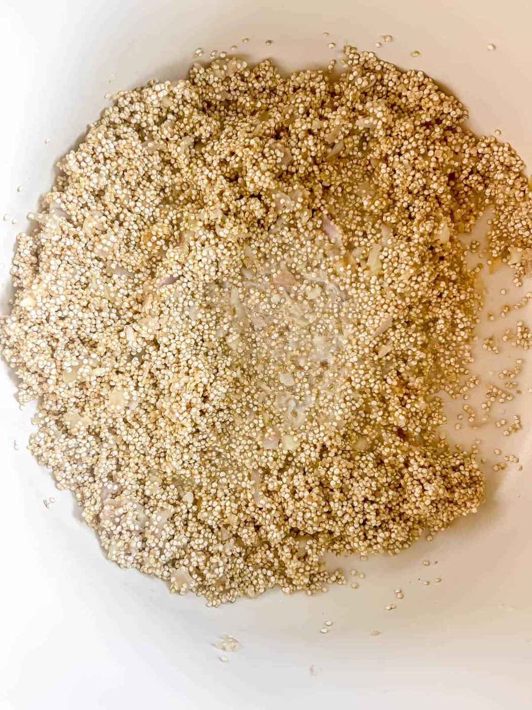 Quinoa added to the pan.