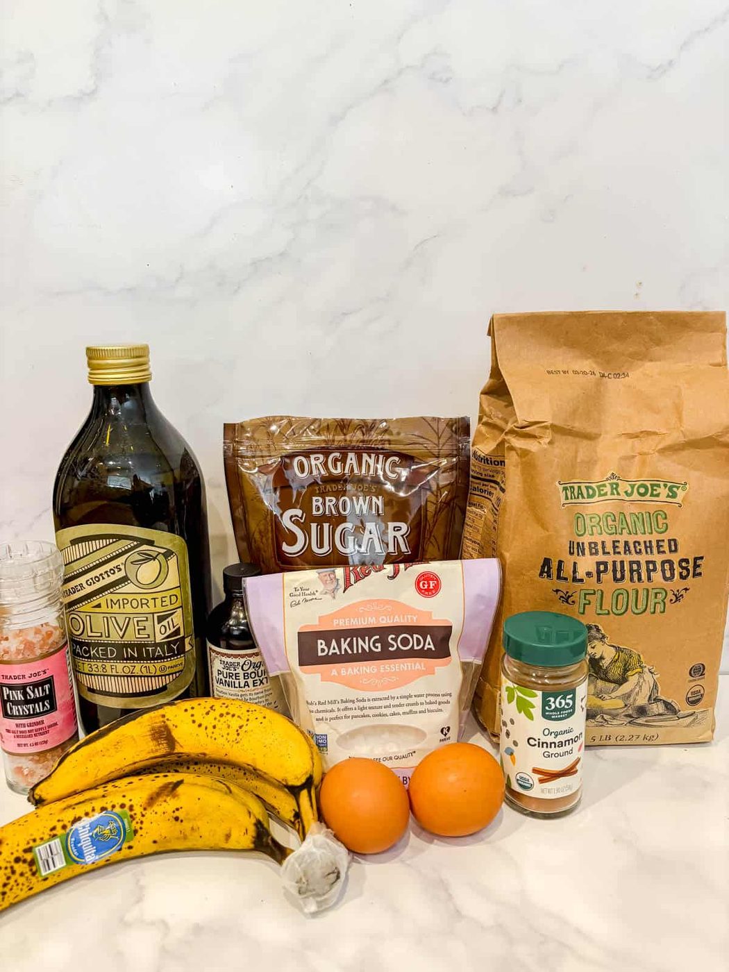 Ingredients needed to make olive oil banana bread.