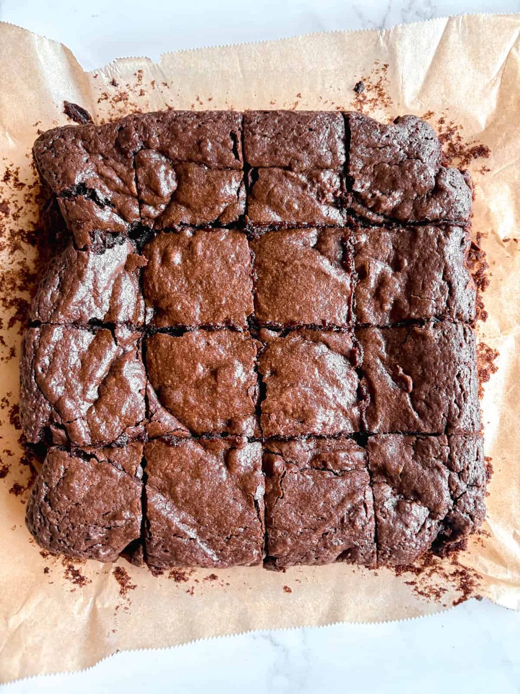 Cutting pieces of olive oil brownies.