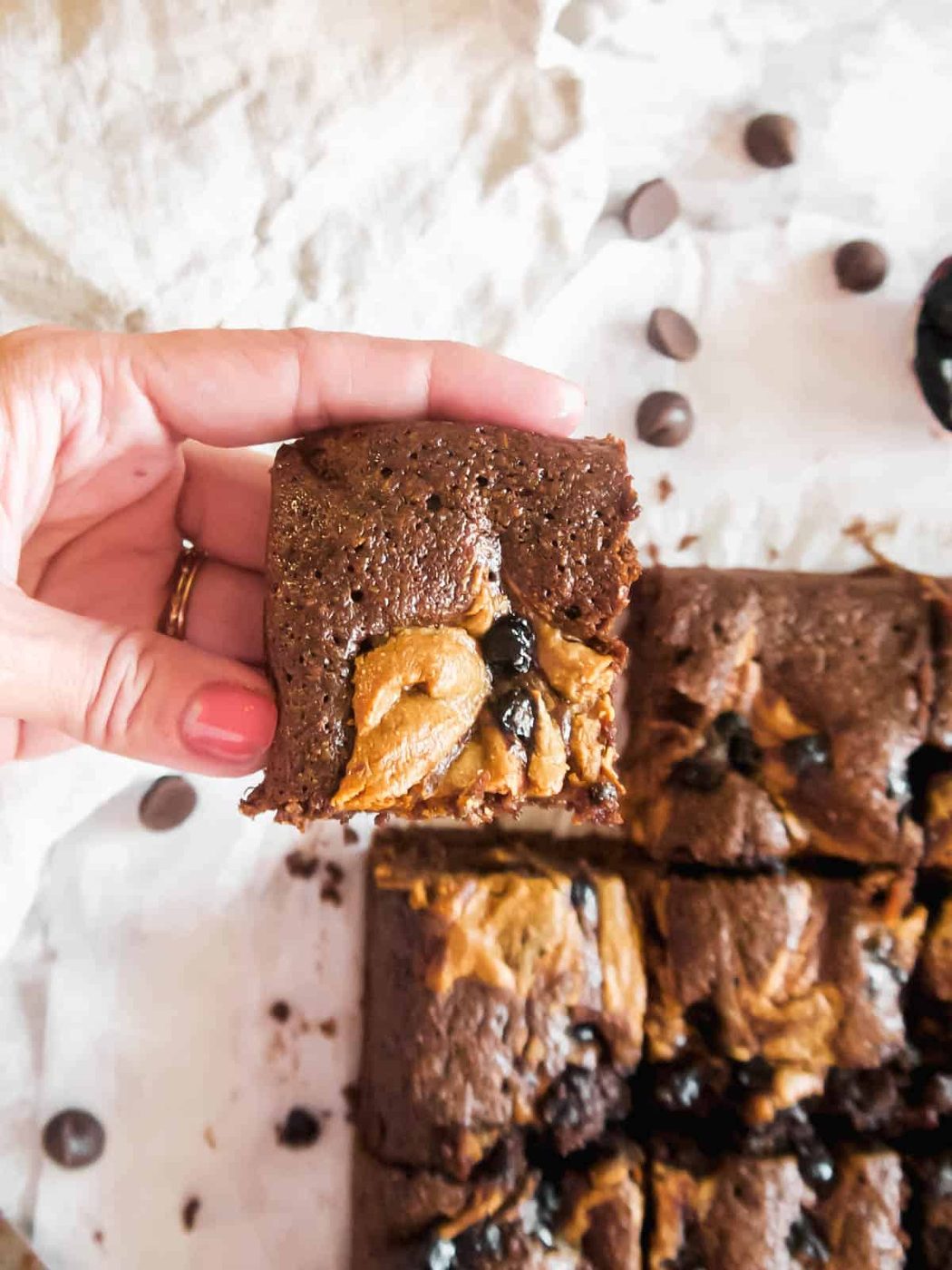 Lifting up a slice of our favorite Paleo brownies!