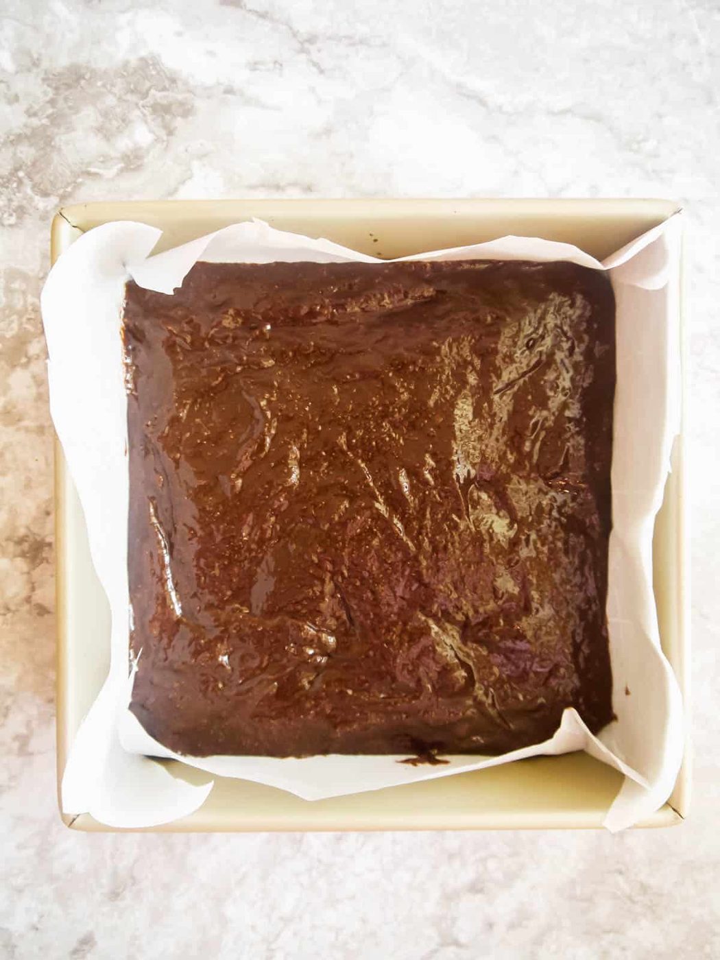Brownie batter poured into pan.
