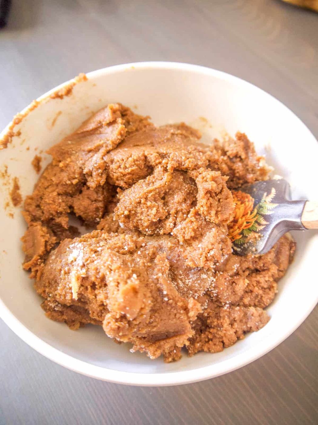 Gingerbread men dough in a bowl.