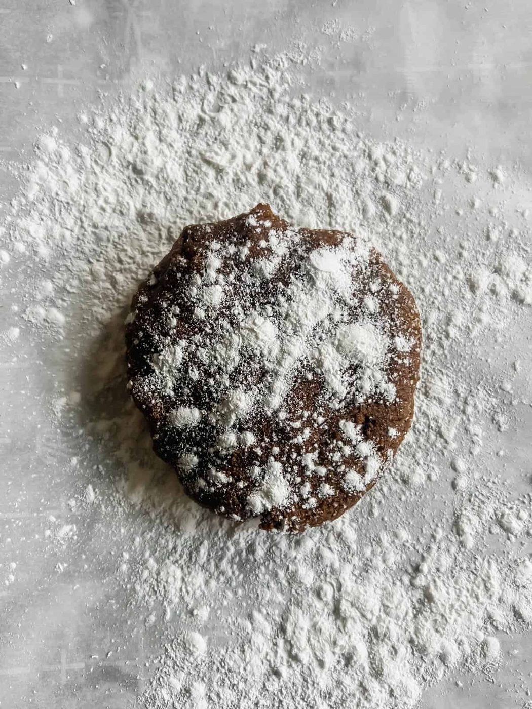 Gingerbread dough on parchment paper with tapioca flour.