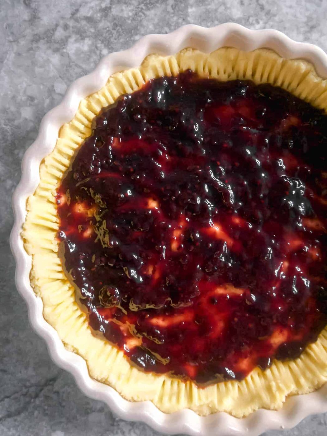 Jam added to the tart.