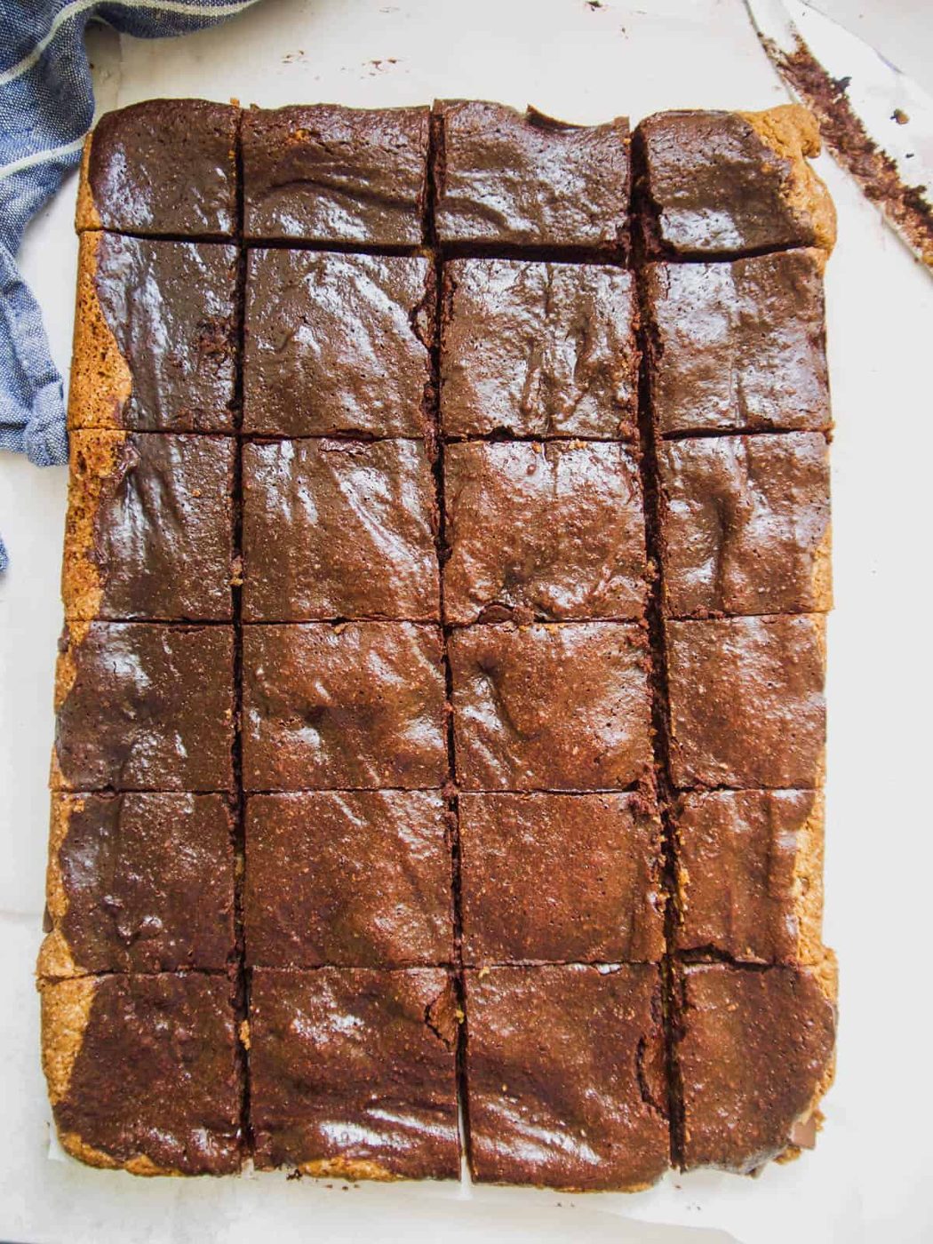 Cutting into paleo brownie cookie bars.