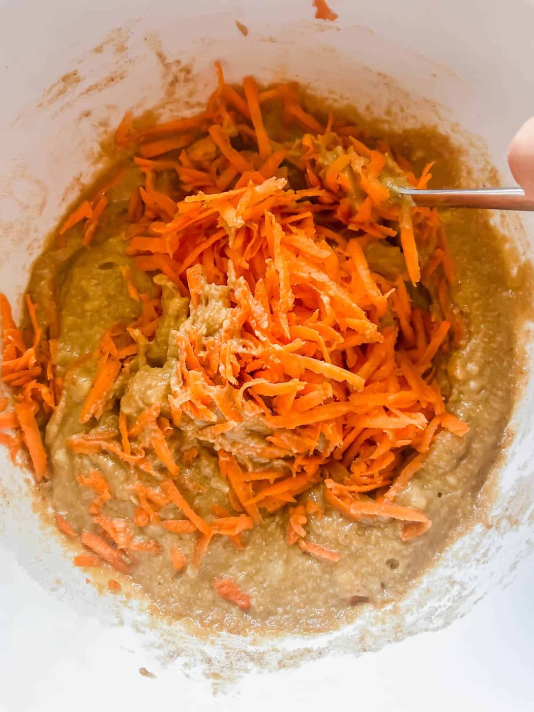 Shredded carrots added to banana bread batter.