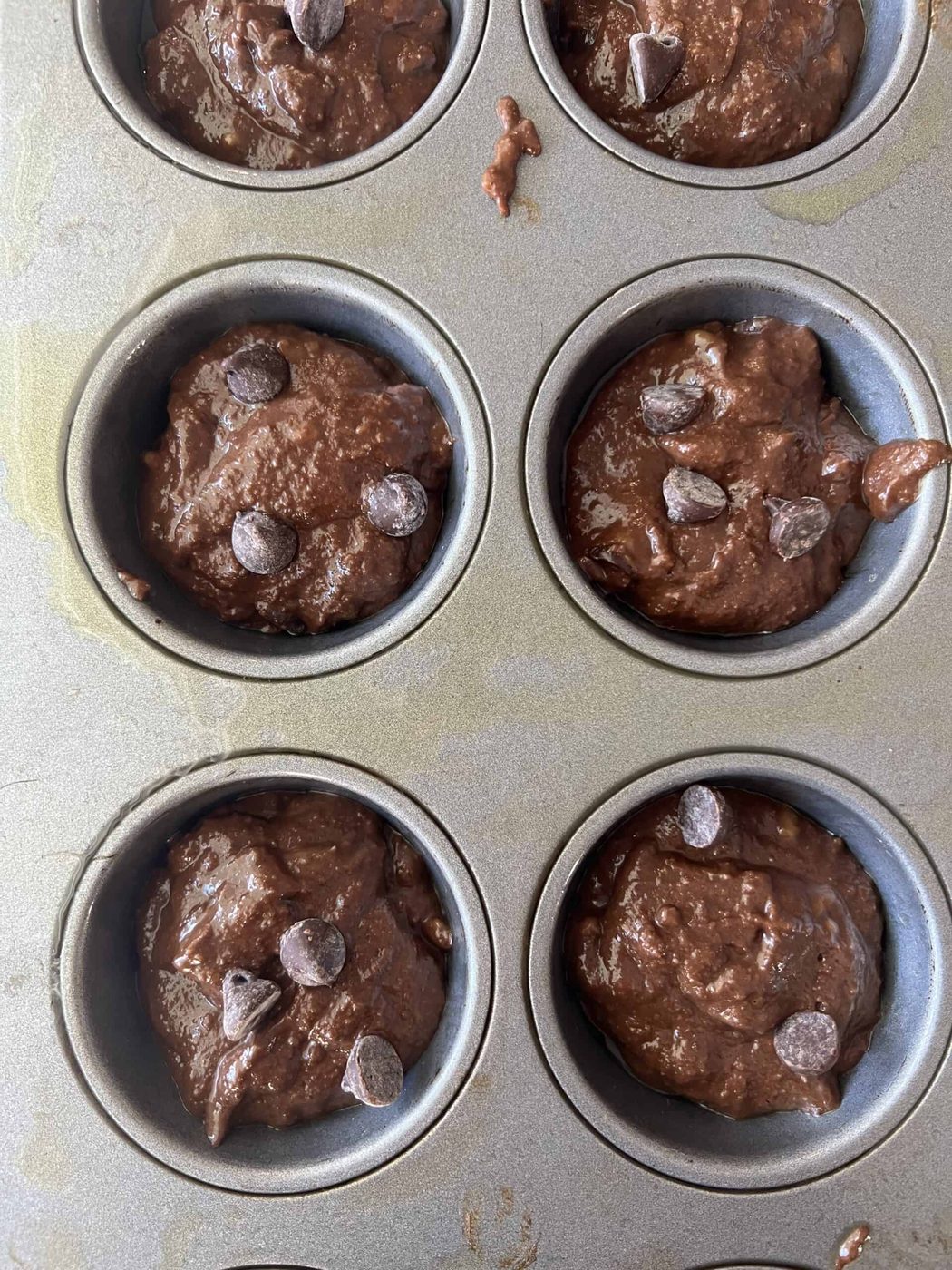Double chocolate banana batter in muffin tins.