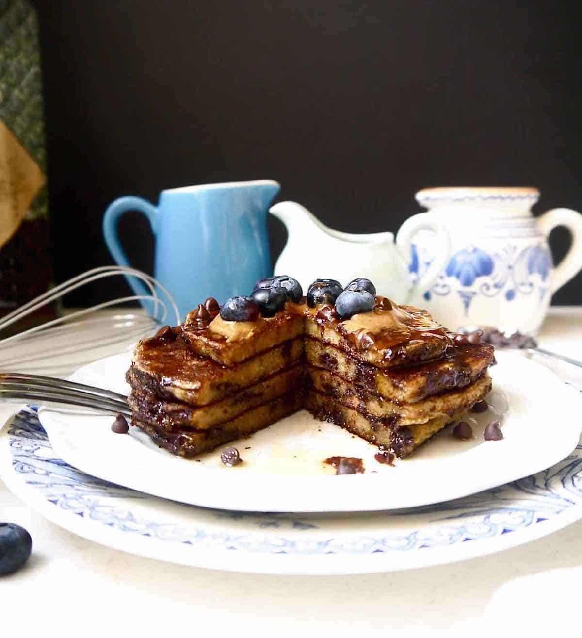 Dairy-free banana pancakes with a chunk cut out of it.