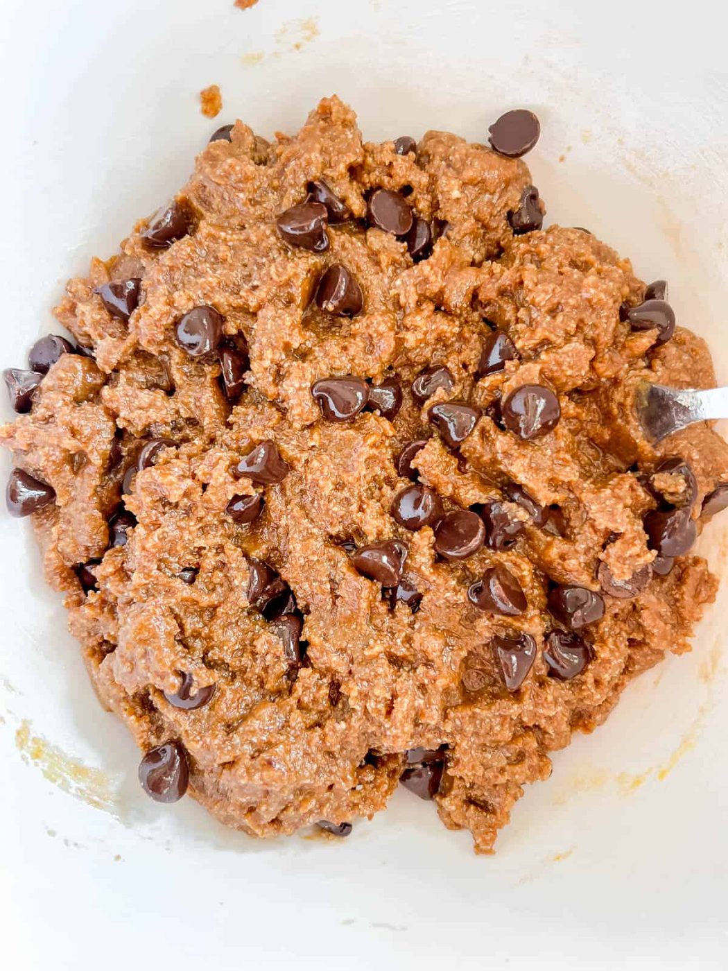 Almond flour cookie bars cookie dough with chocolate chips.