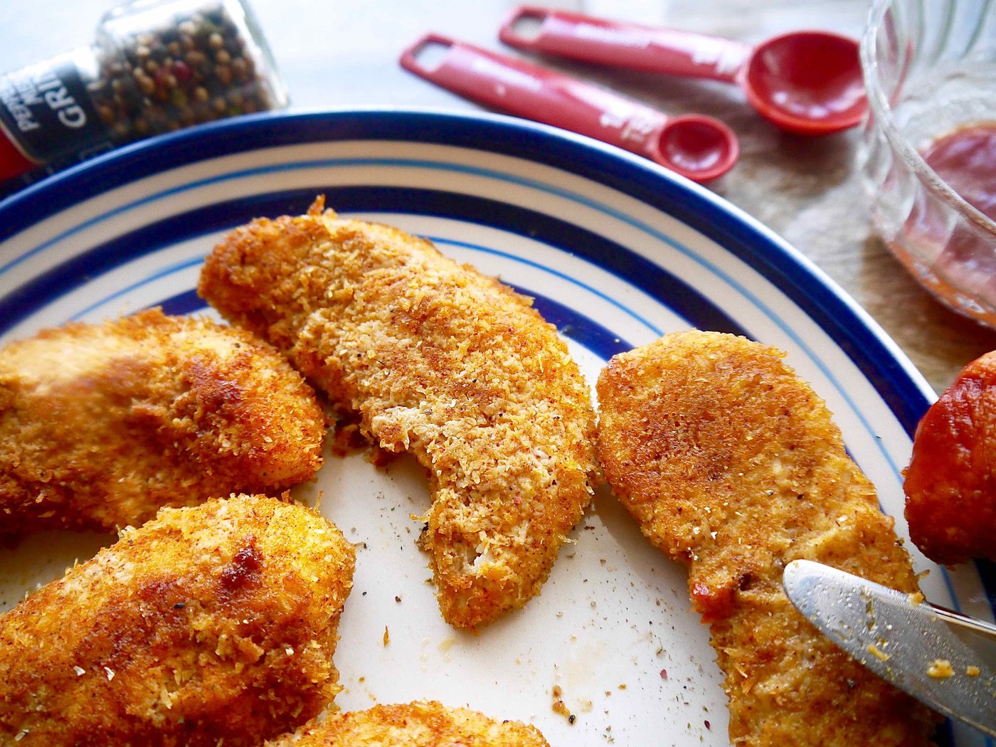 Whole30 chicken tenders on a plate.