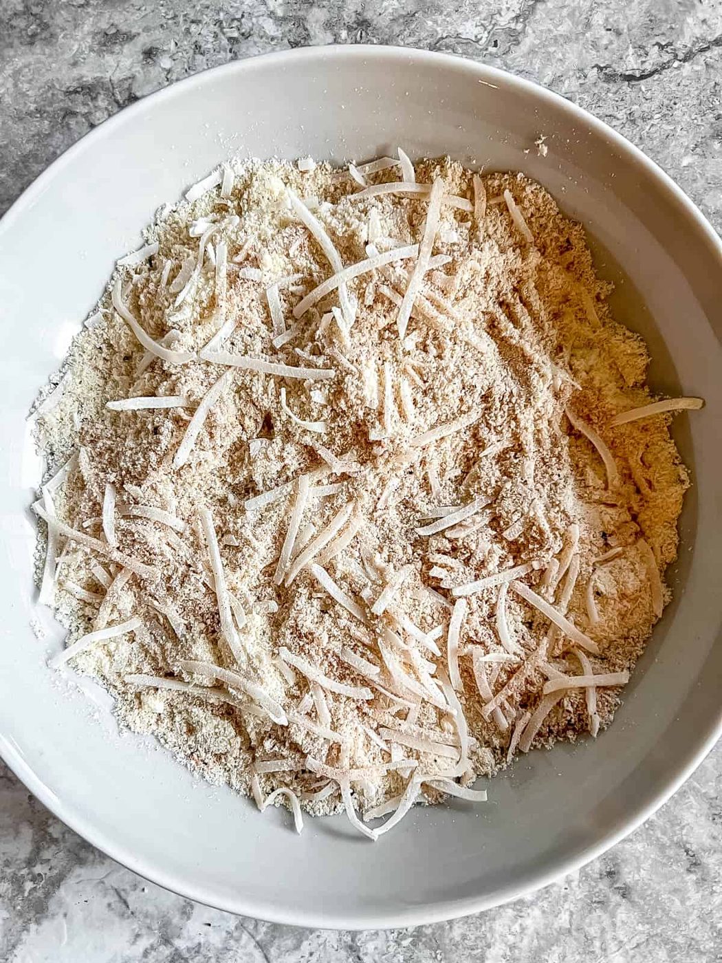 Almond flour, shredded coconut mixture in bowl.