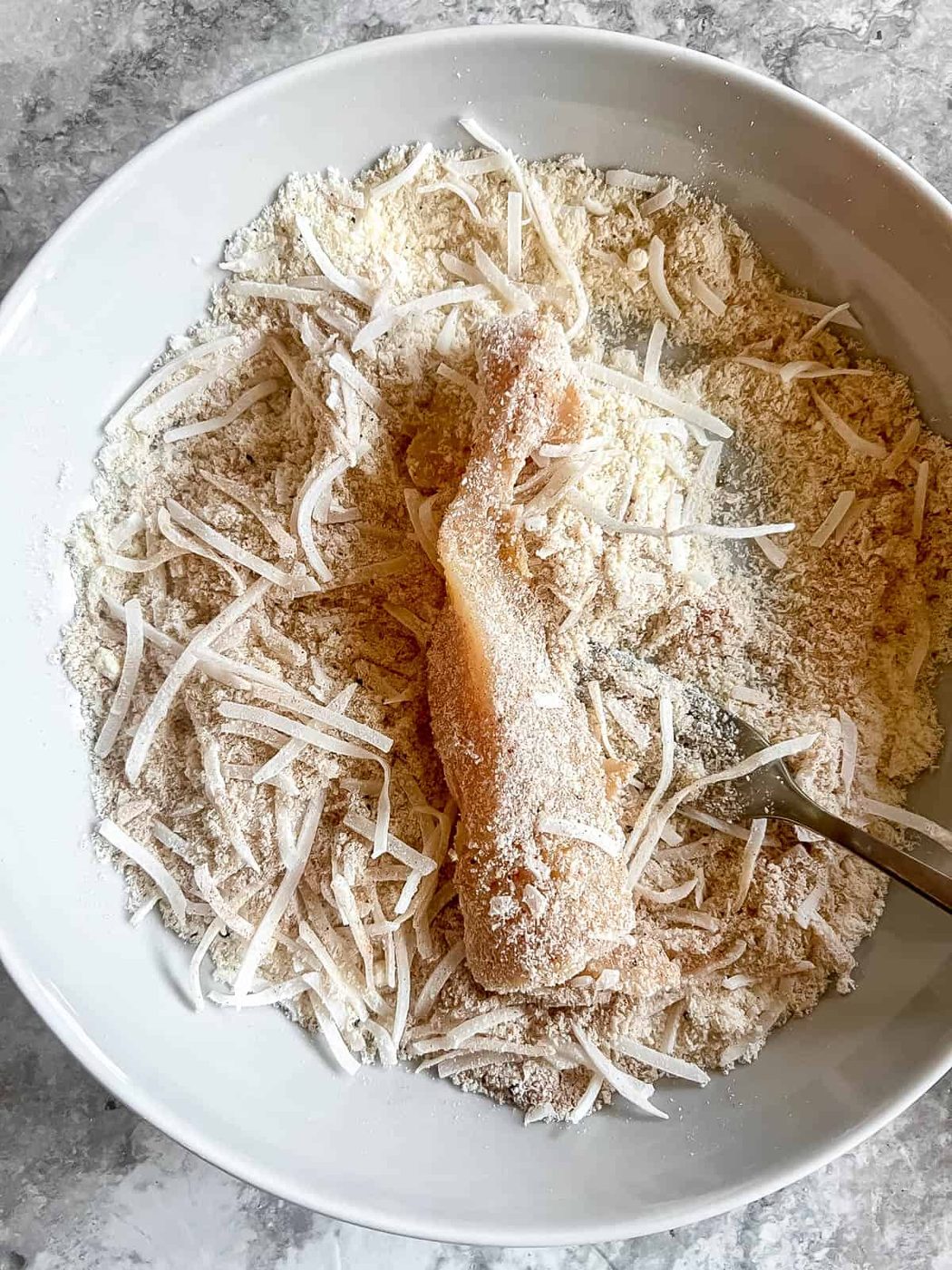 Chicken dunked in egg then the almond flour mixture.