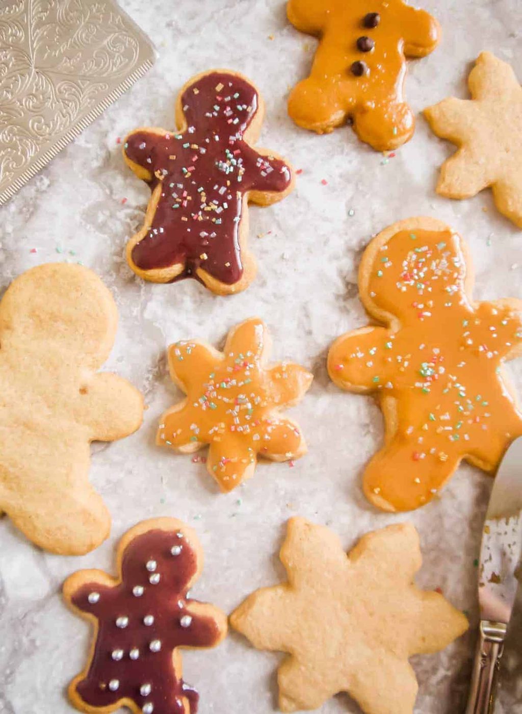 Maple cut out cookies on a table.