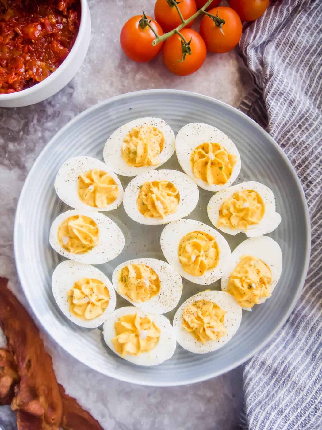 Paleo Deviled Eggs topped with Tomato Bacon Jam (GF)