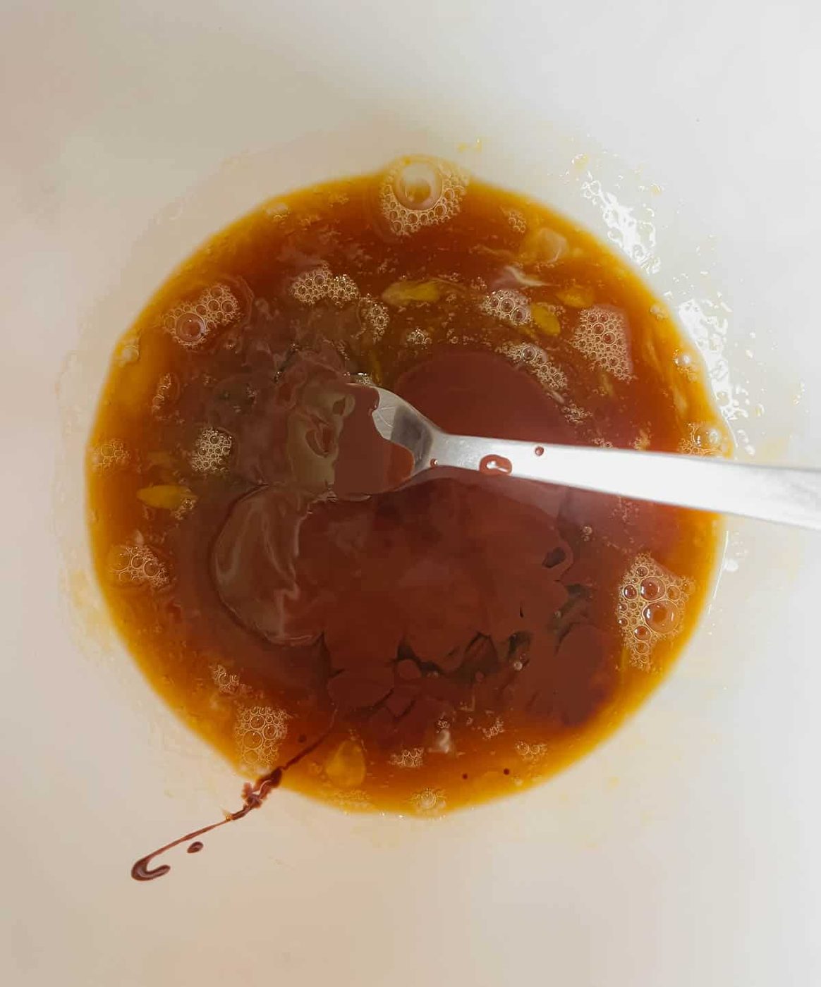 Melted chocolate added to the eggs.
