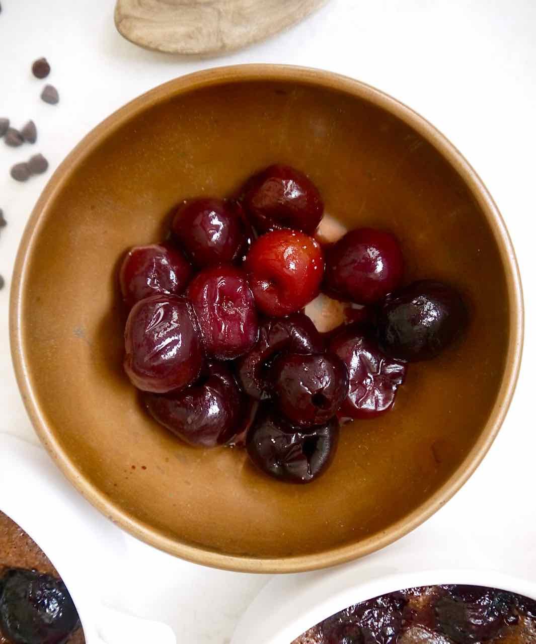 Pitted cherries in a bowl.