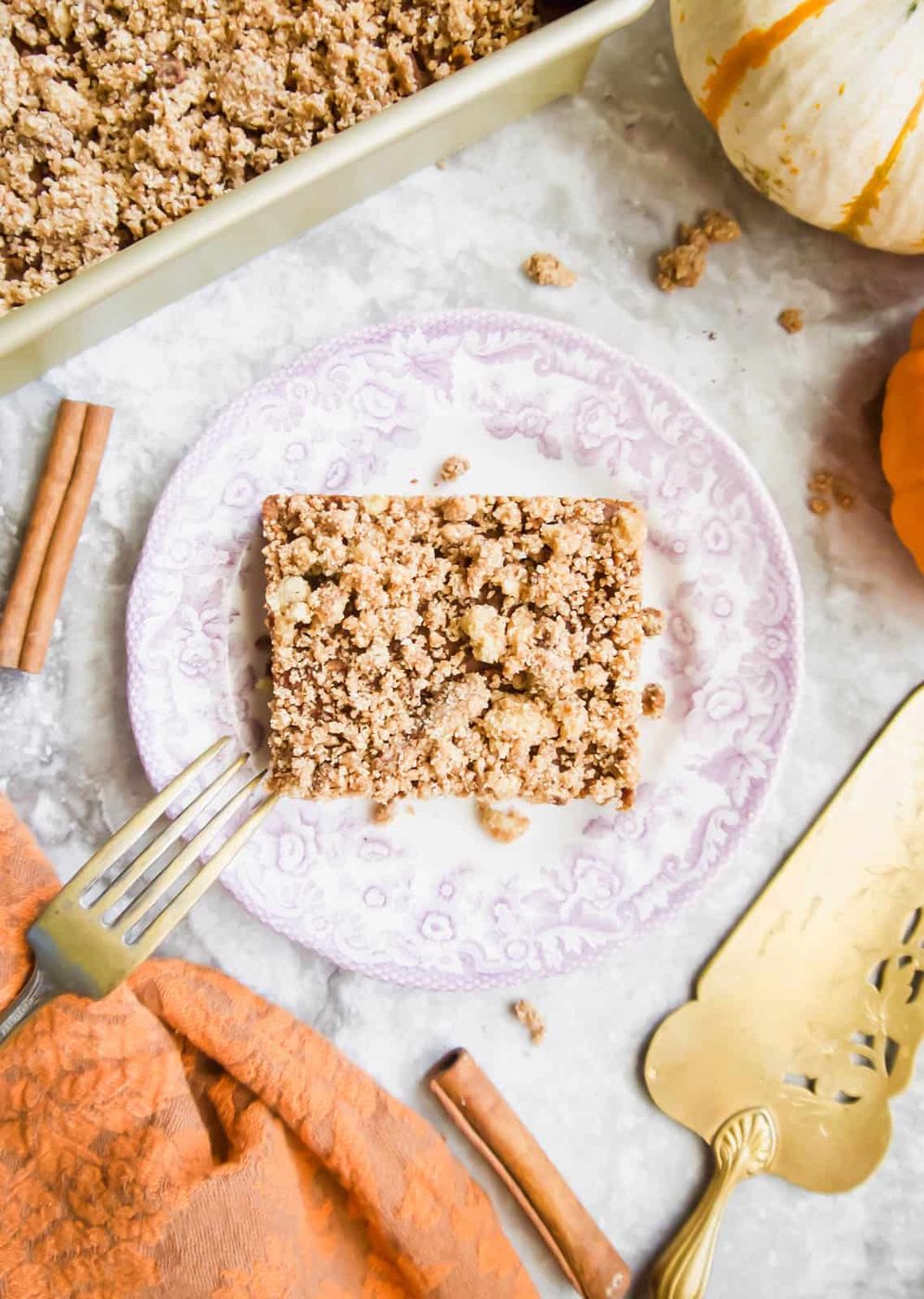 A slice of Gluten-free Pumpkin Coffee Cake on a plate.