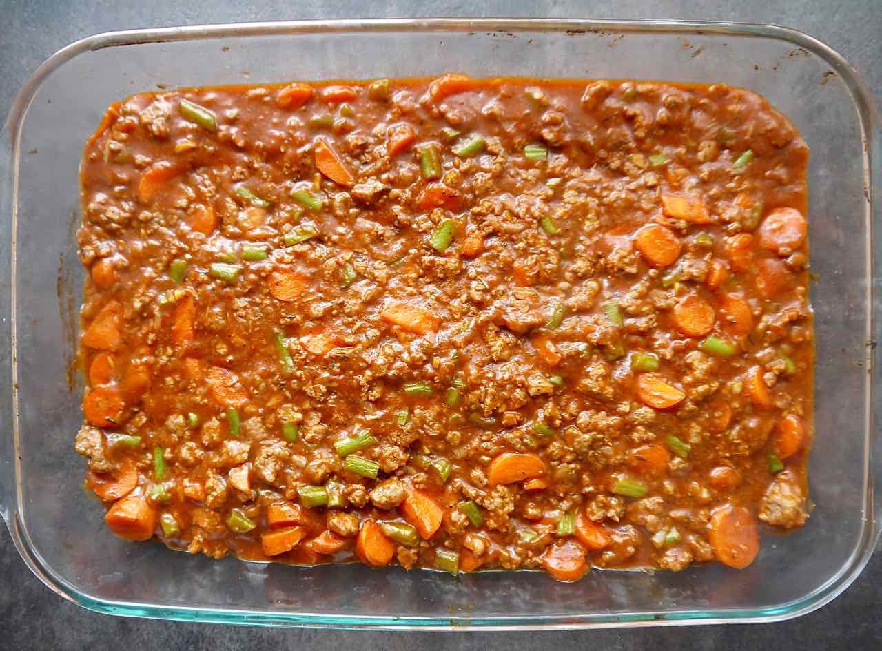 Lamb gravy in a baking dish.