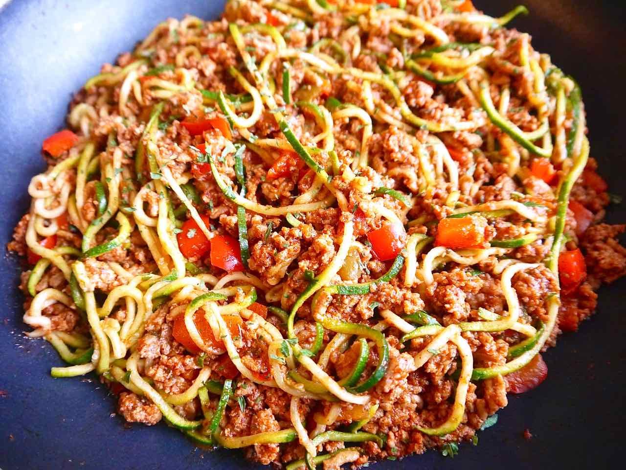 Mixing the taco meat with zoodles.