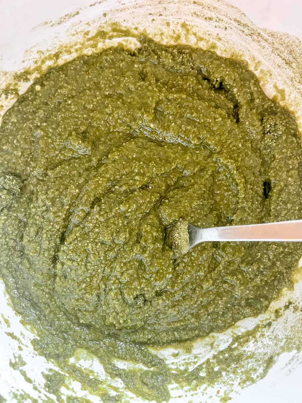 Wet and dry ingredients mixed together in a bowl.