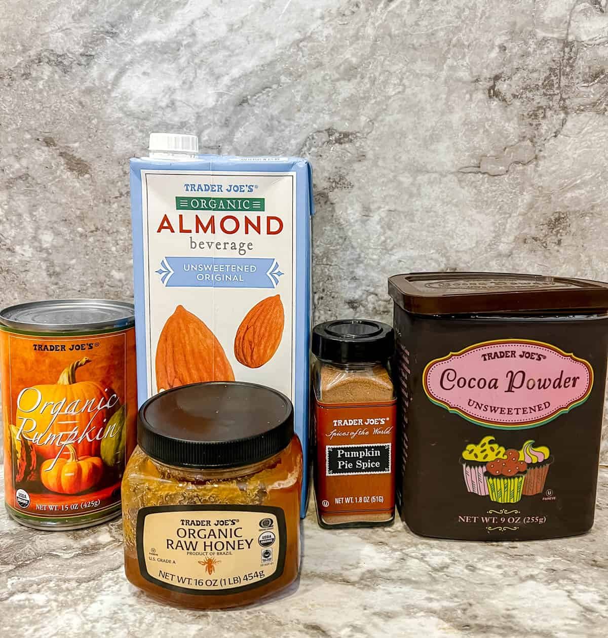 Ingredients needed to make pumpkin spice hot chocolate.