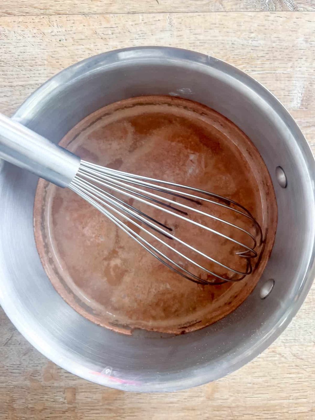 Whisking the pumpkin spice hot chocolate after it cooks.