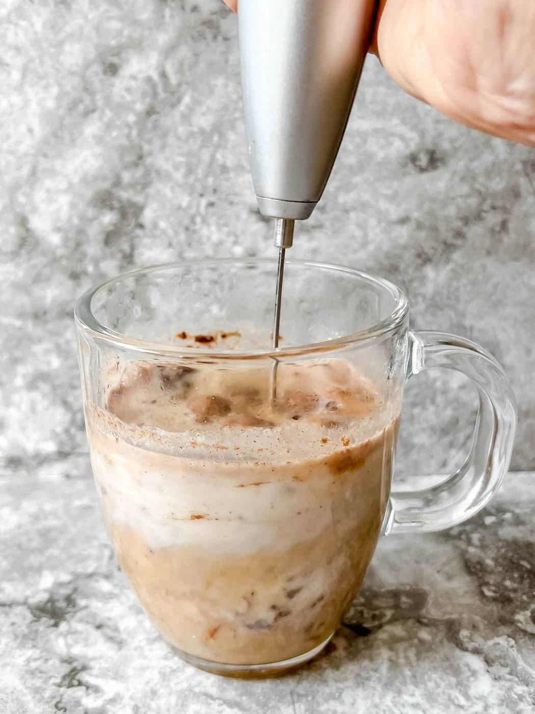 Frother mixing pumpkin hot chocolate.