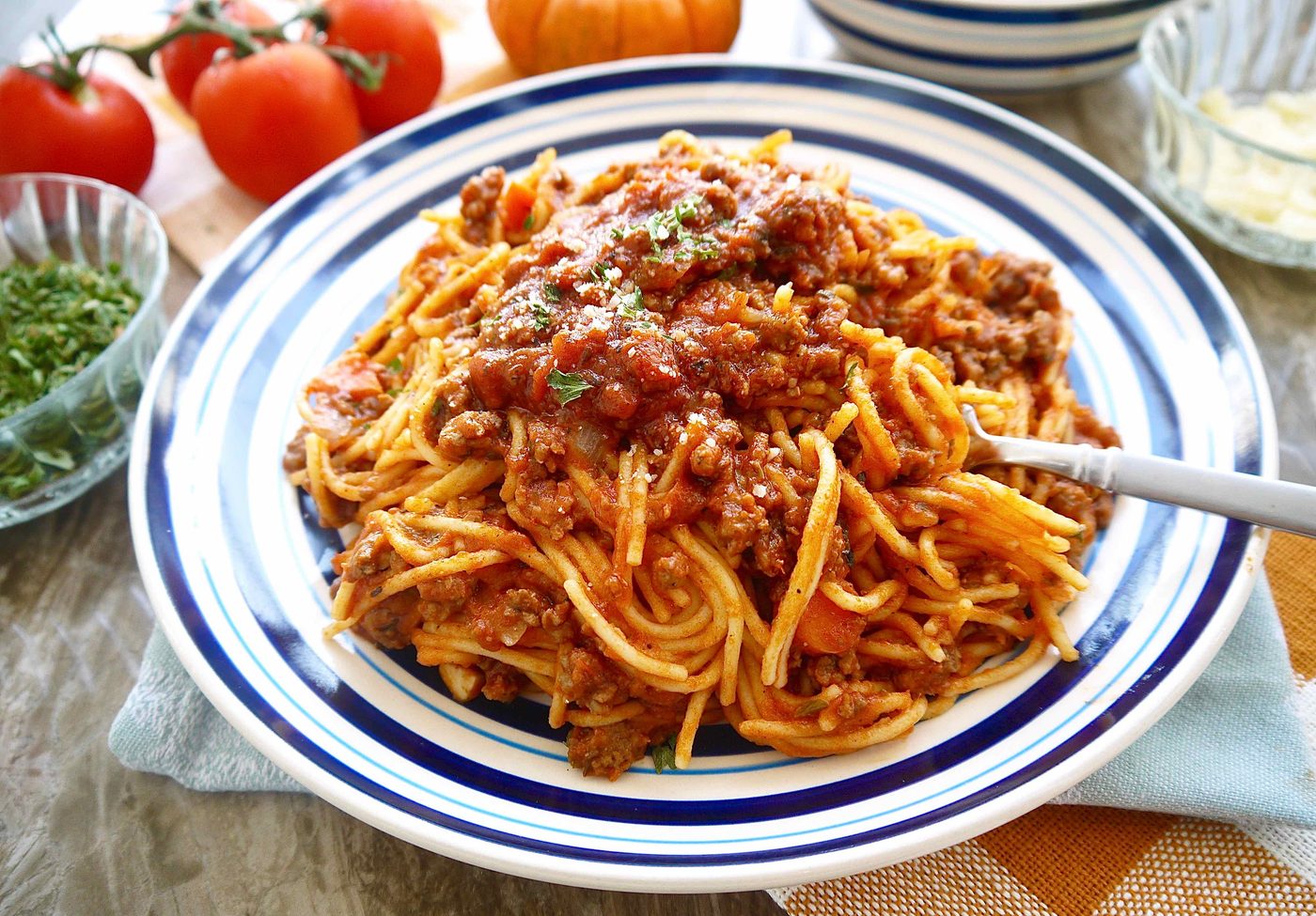 Pumpkin meat sauce in a large plate with a fork in it.