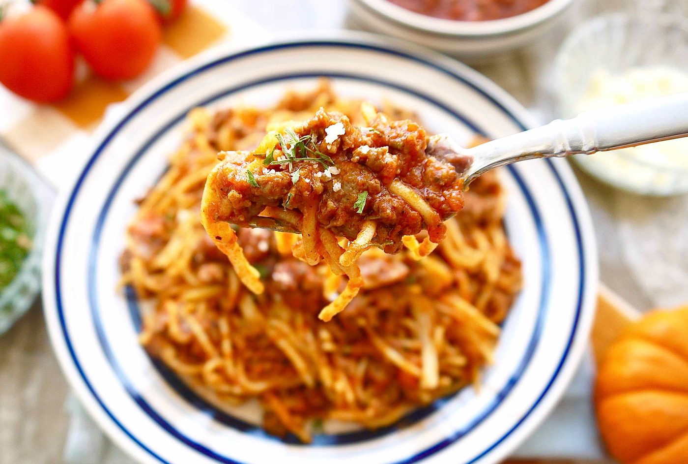 A bite of pumpkin ragu on a fork.