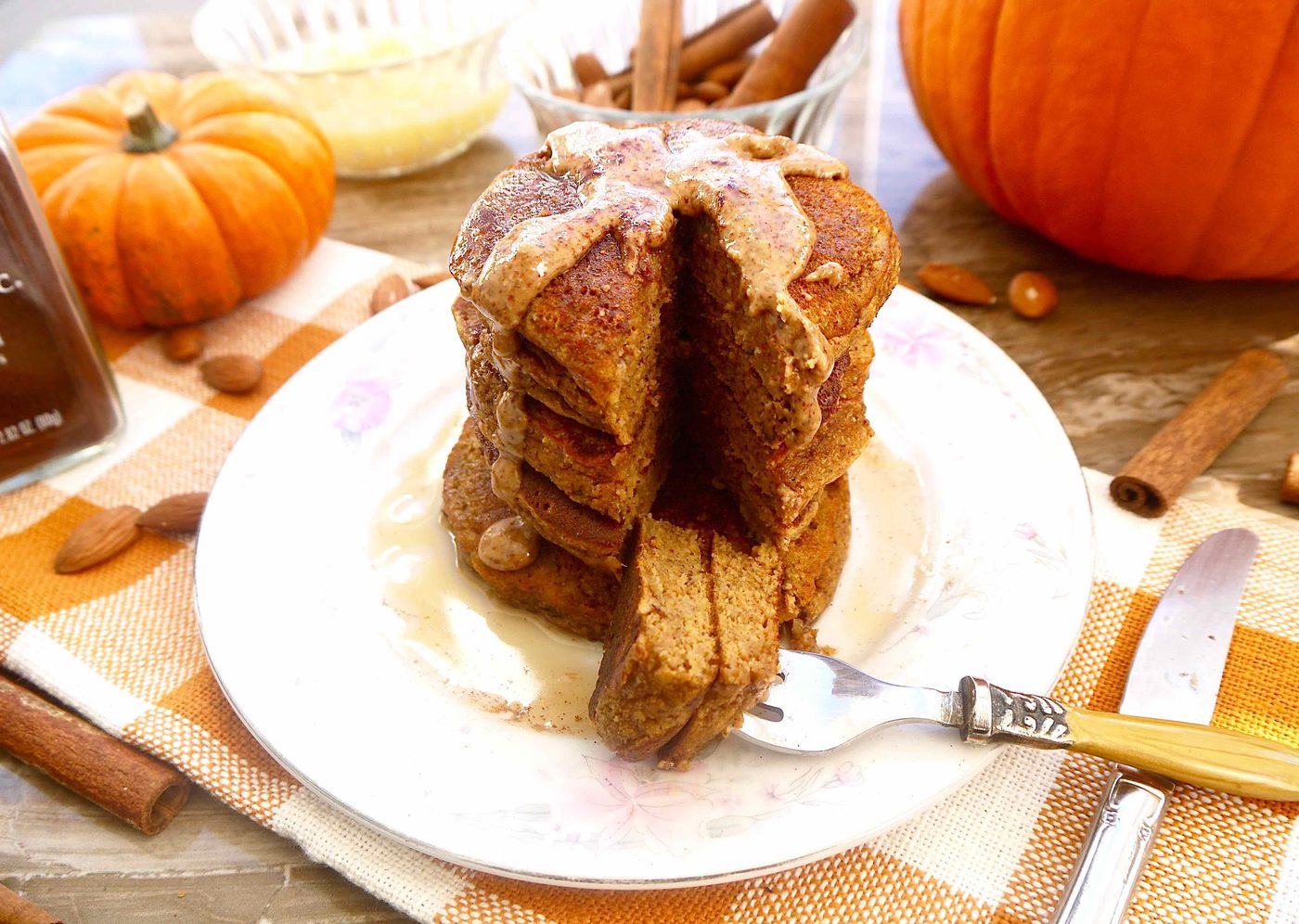A bite taken out of grain free pumpkin pancakes.