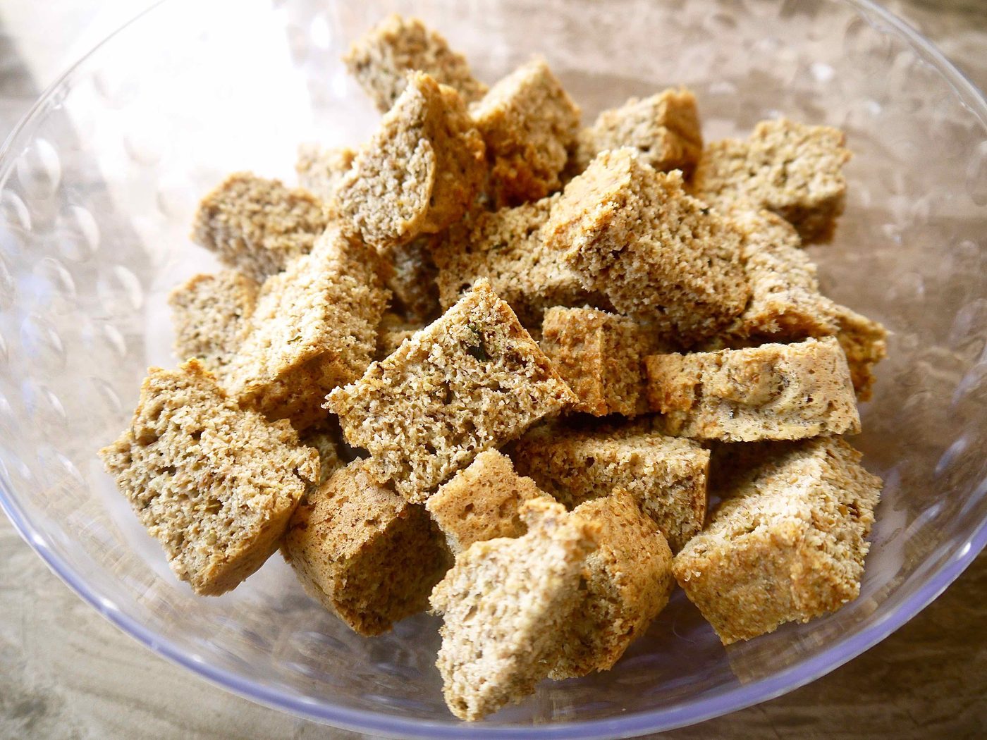 Cubed flaxseed bread in a bowl.