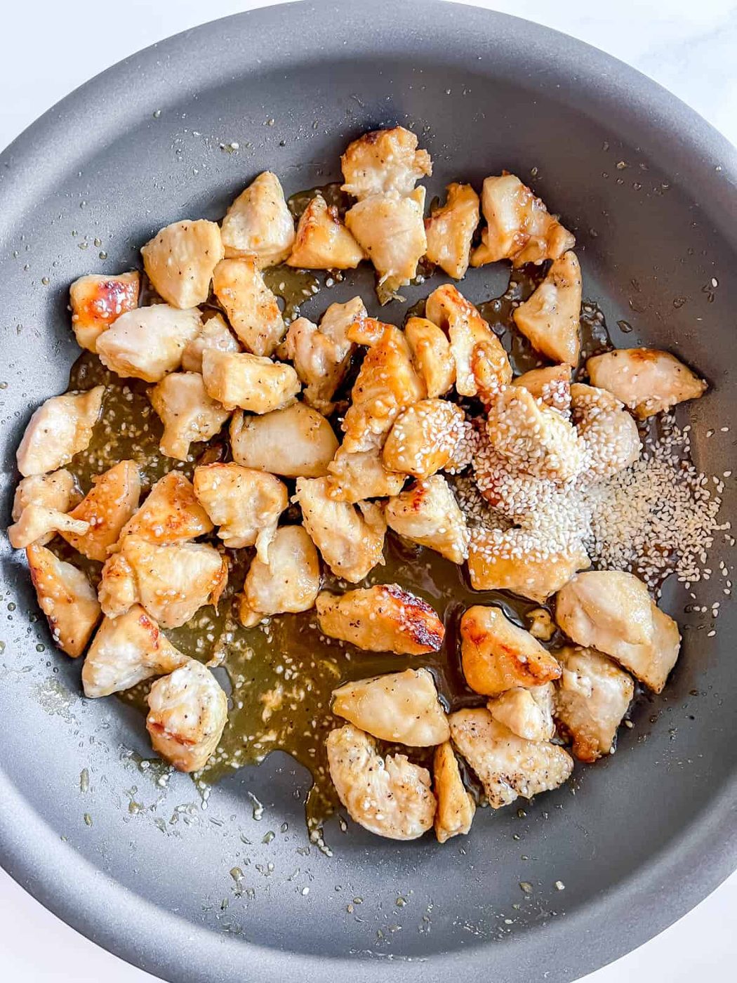 More honey and sesame seeds added to the chicken.