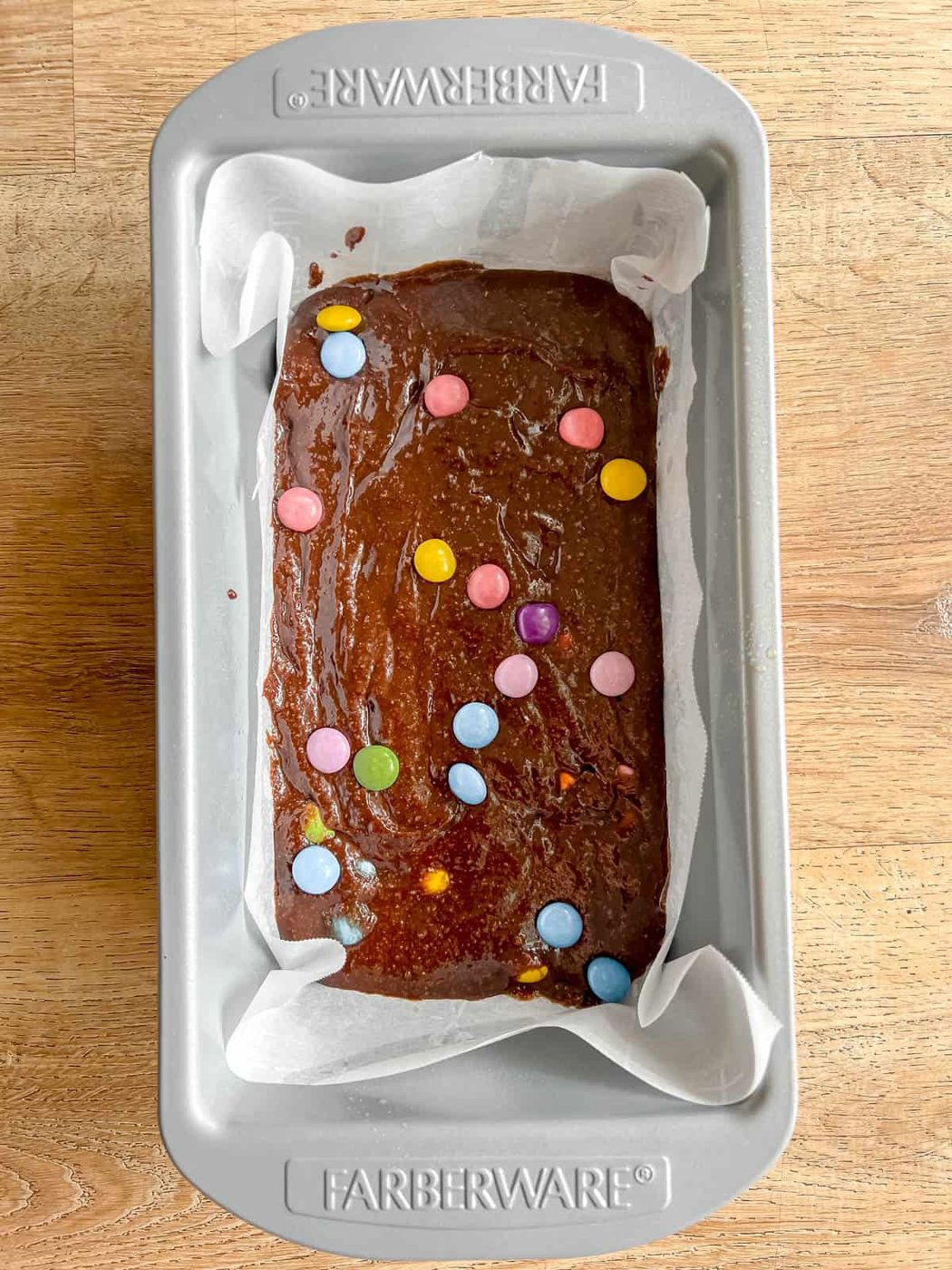 Almond flour brownie batter in a pan before baking.
