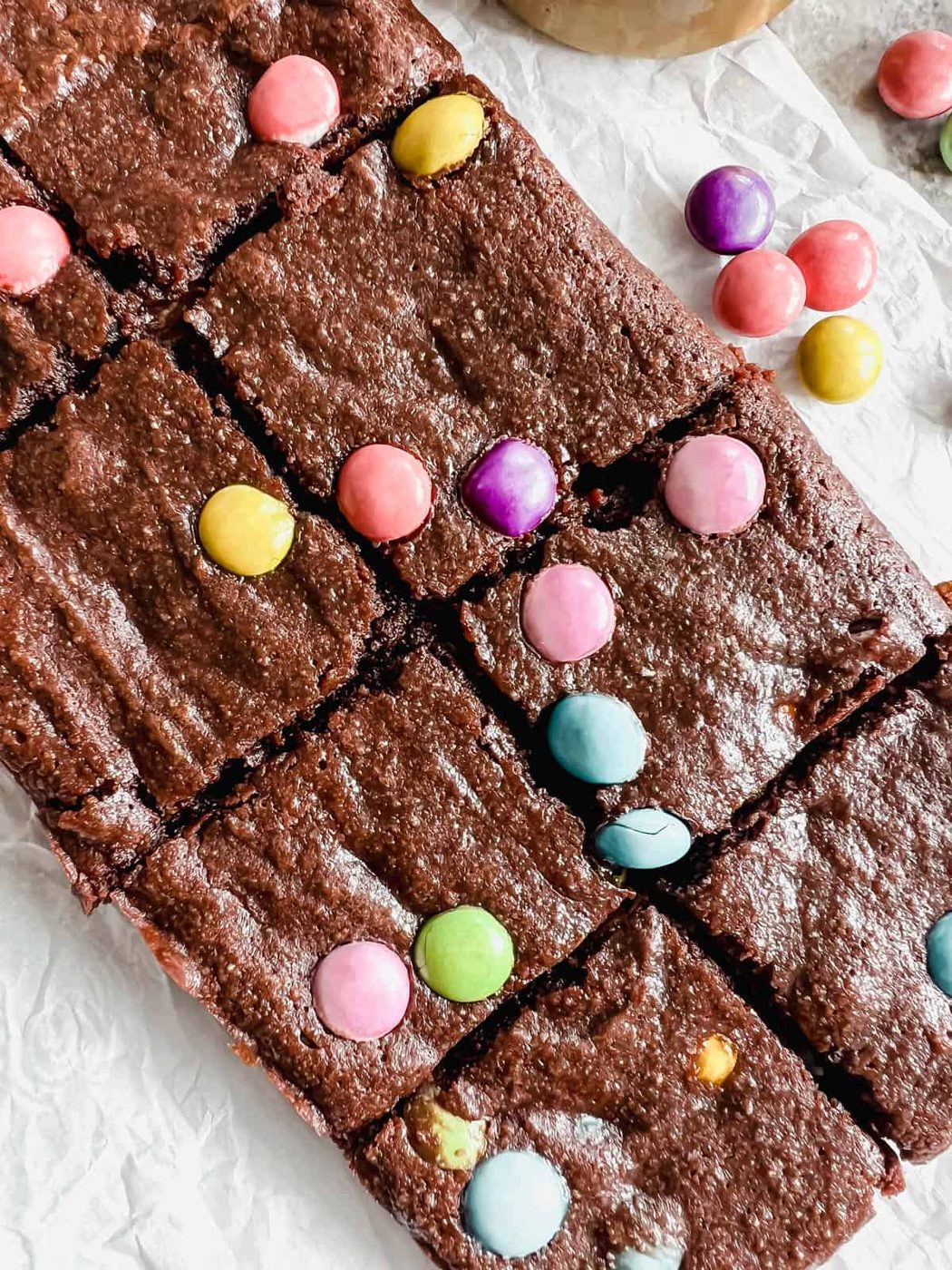 Fudgy almond flour brownies sliced into pieces.