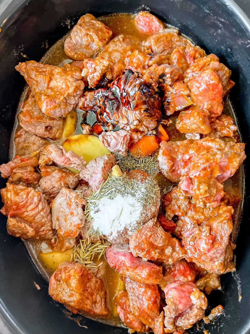 All of the ingredients in the crock pot before cooking.