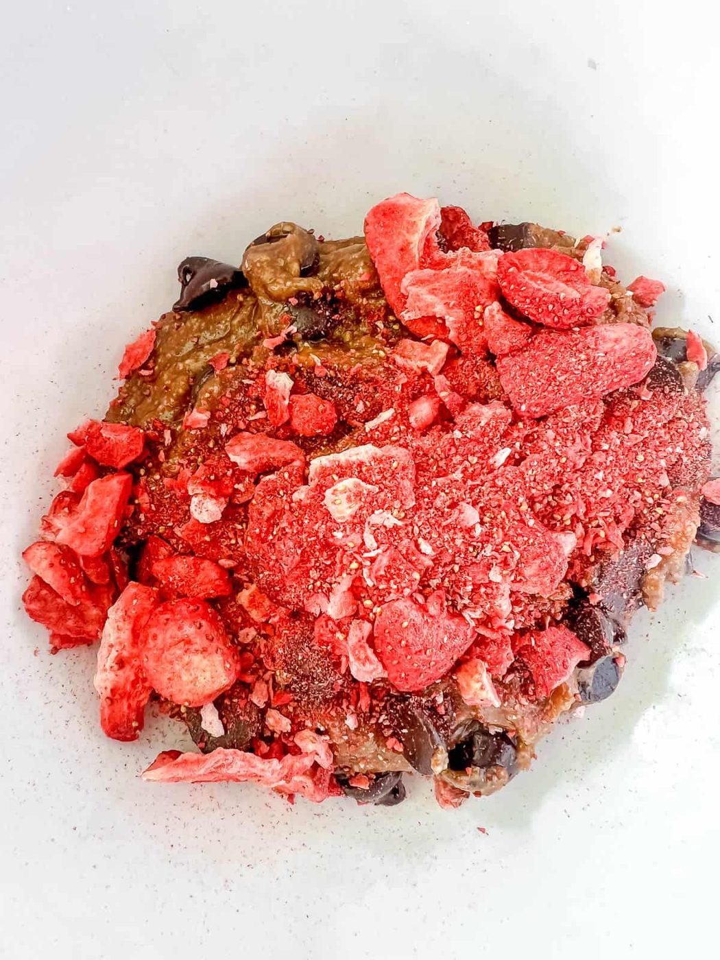 Freeze dried strawberries added to the batter.