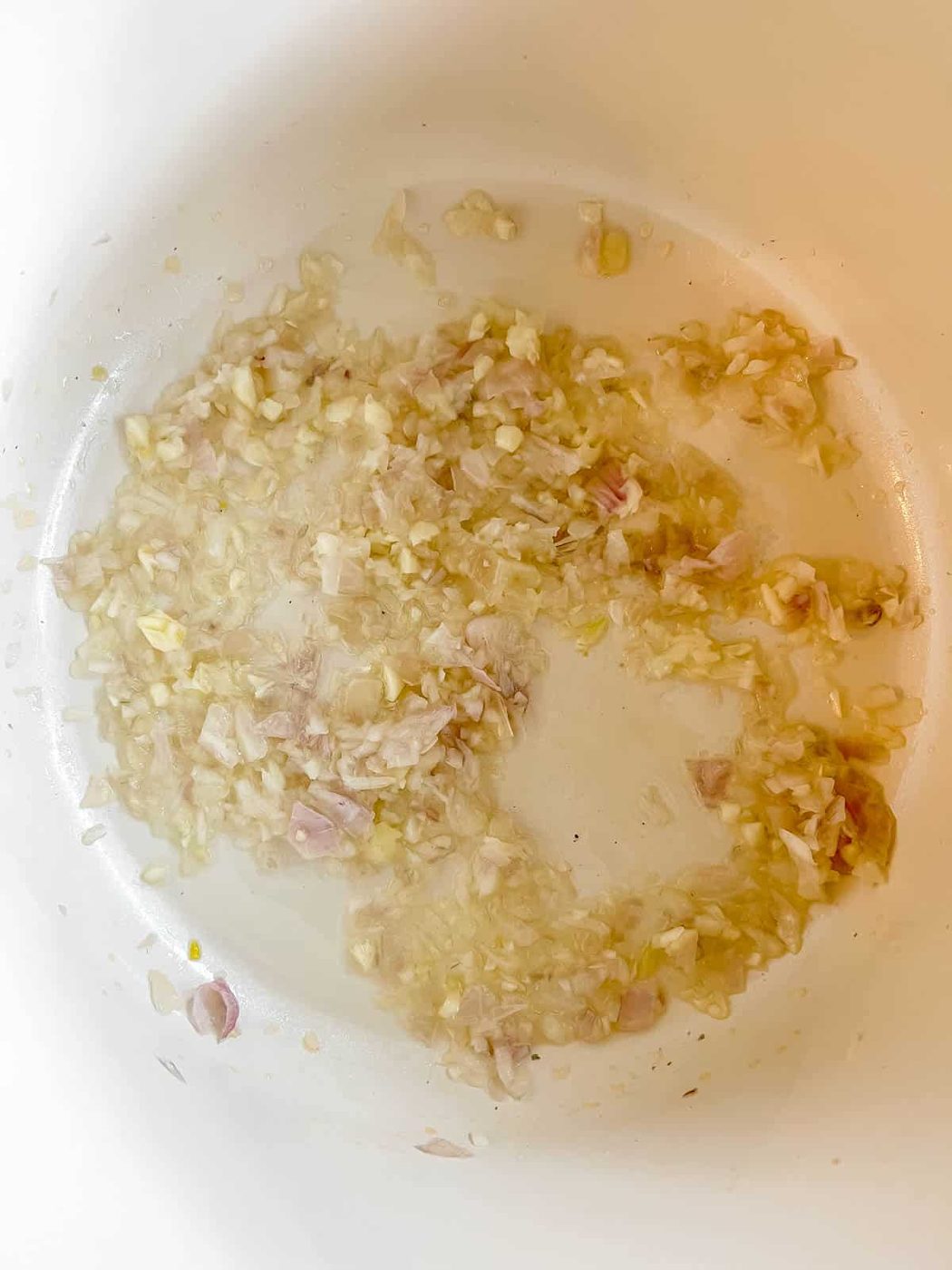 Onions and garlic in a pan.