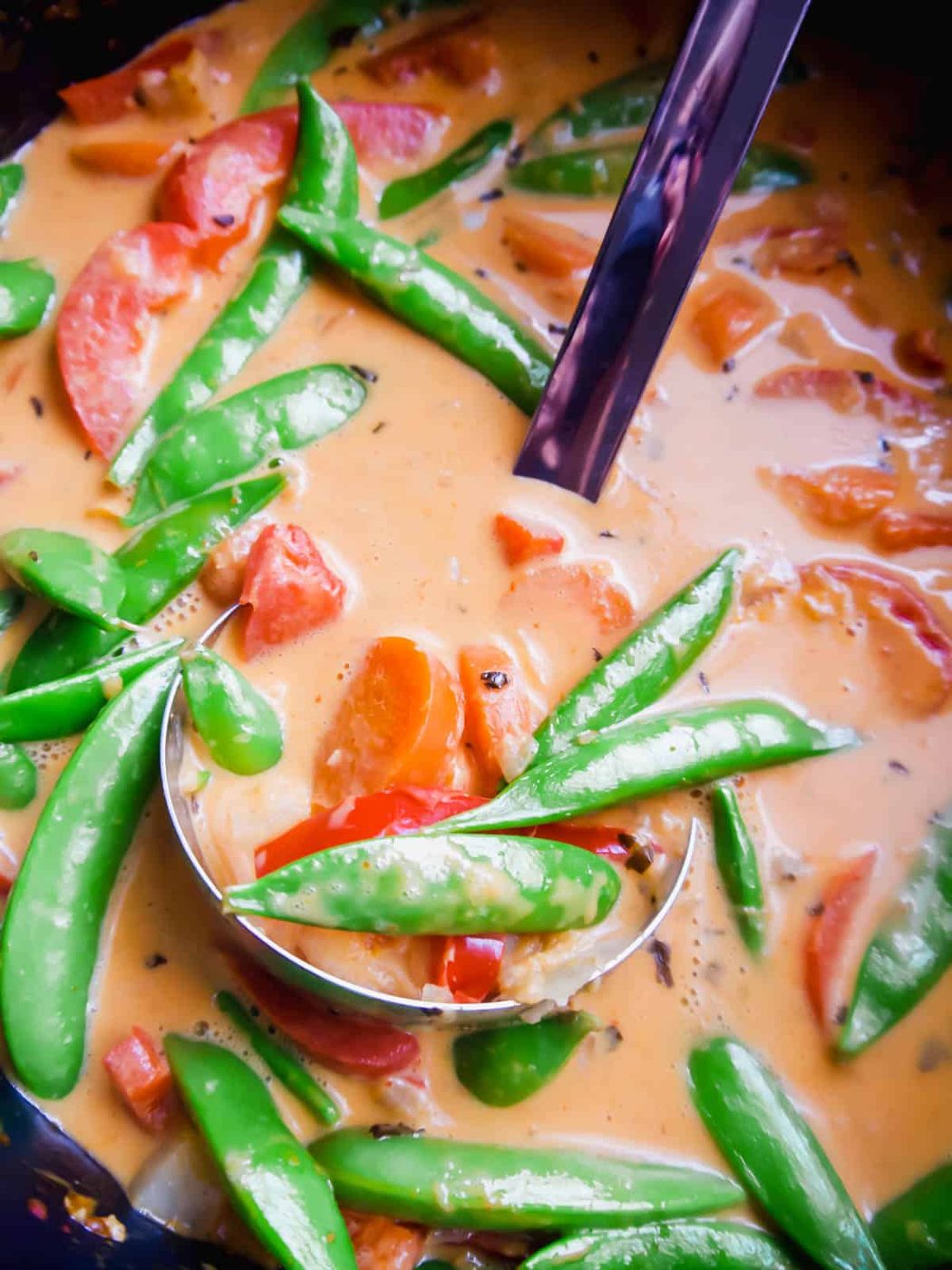 Snap peas added to paleo Thai red curry.
