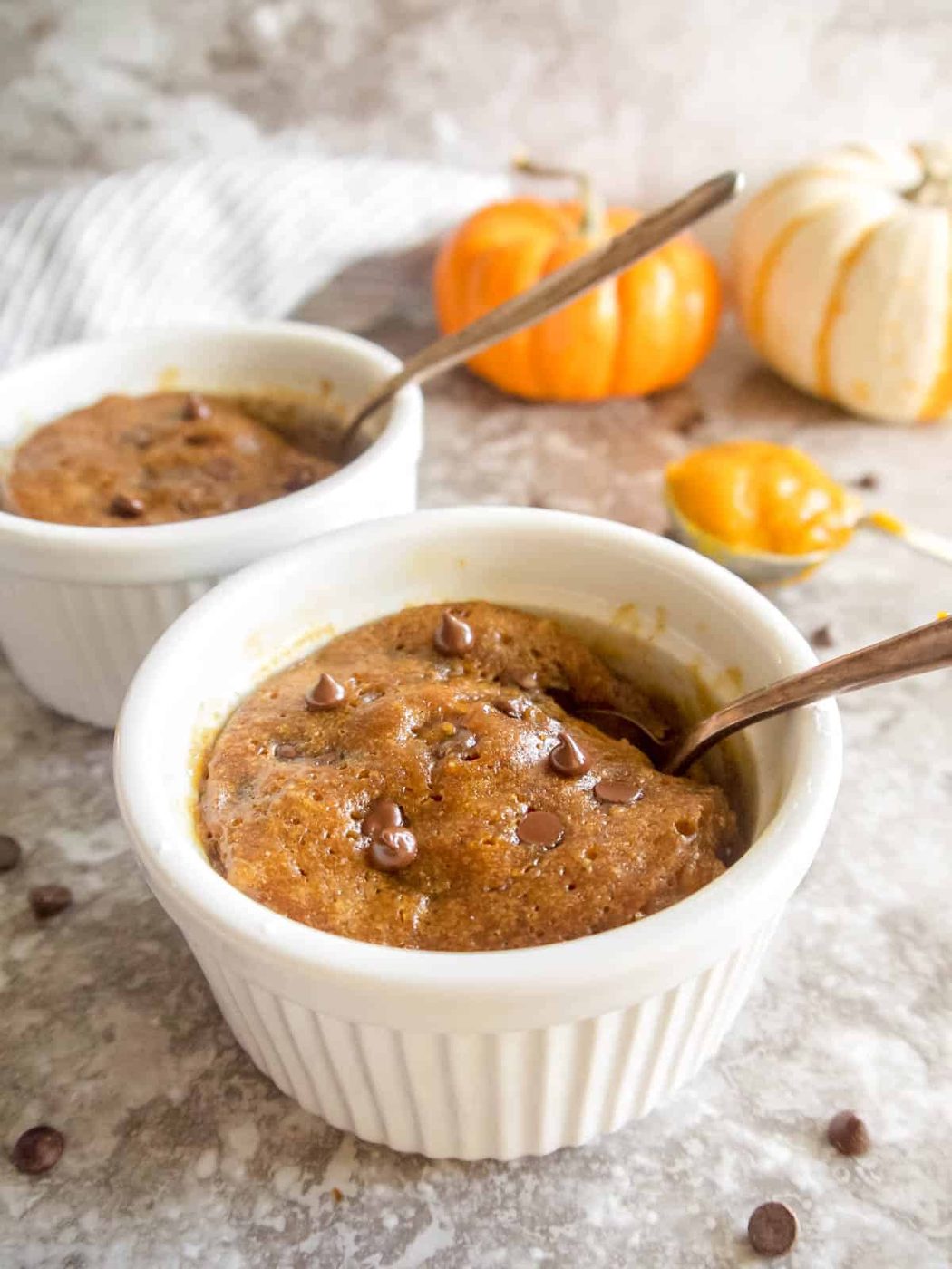 Pumpkin mug cake after being heated in microwave.