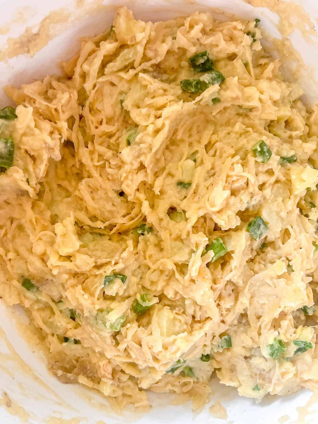 The shredded potatoes mixed into the mashed potato mixture.