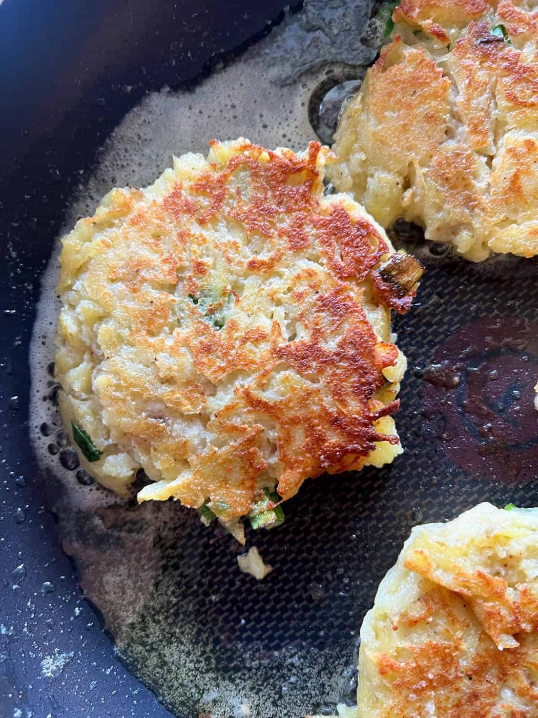Potato pancakes cooked on a pan.