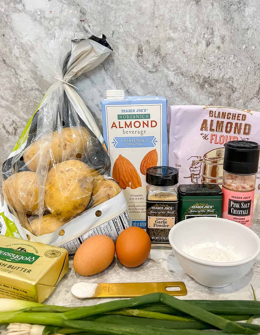 Ingredients needed to make gluten free potato pancakes.