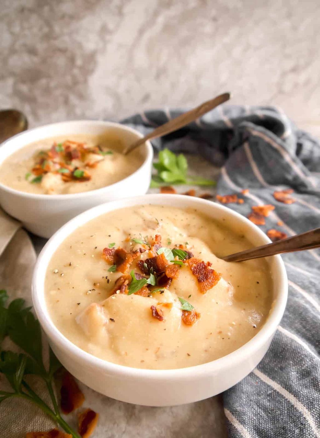 Spoon in bowl of whole30 baked potato soup.