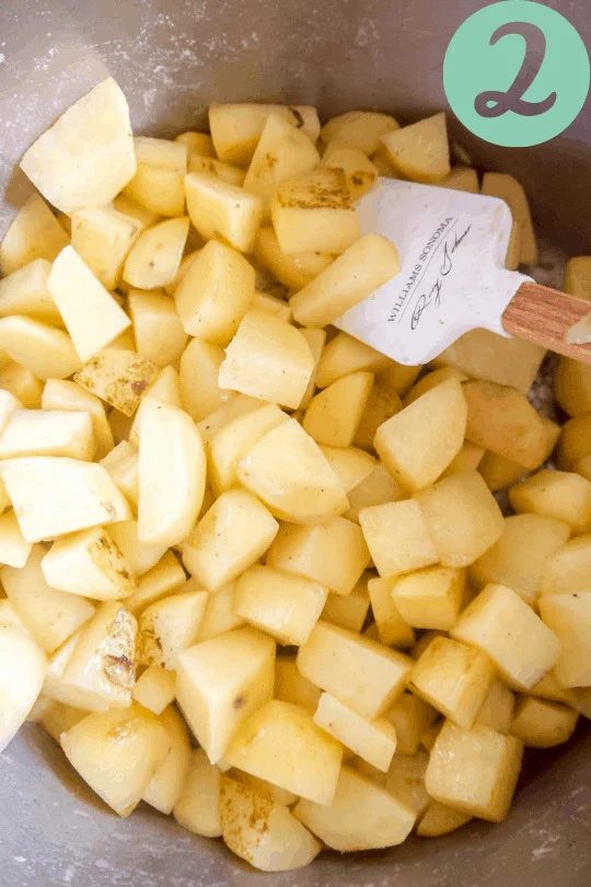 Potatoes added to the pan.